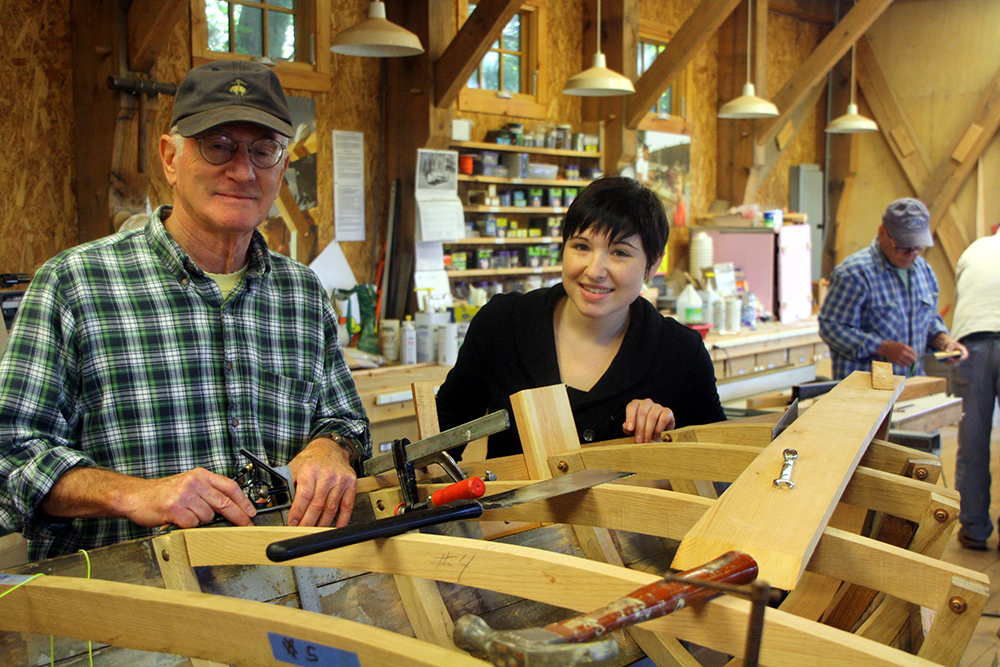 Boat builder Charles Kenney and a student in his shop